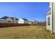 Large backyard with grassy area and wooden fence at 1762 Wood Stork Dr, Hampton, GA 30228