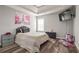 Cozy bedroom with double bed, dresser, and wood-look floors at 1762 Wood Stork Dr, Hampton, GA 30228