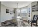Dining area with bay window and modern light fixture at 1762 Wood Stork Dr, Hampton, GA 30228