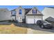 Two-story brick home, two-car garage, front yard at 1762 Wood Stork Dr, Hampton, GA 30228