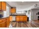 Eat-in kitchen with wood cabinets and stainless steel appliances at 1762 Wood Stork Dr, Hampton, GA 30228