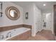 Spa-like bathroom with soaking tub, walk-in shower and separate vanity at 2950 Mount Wilkinson Se Pkwy # 304, Atlanta, GA 30339