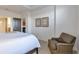 Serene bedroom with comfortable seating and access to another room at 2950 Mount Wilkinson Se Pkwy # 304, Atlanta, GA 30339