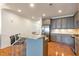 Modern kitchen with gray cabinets and granite countertops at 2950 Mount Wilkinson Se Pkwy # 304, Atlanta, GA 30339