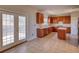 Kitchen with French doors leading to a private patio or backyard at 8136 Woodland Ct Se, Covington, GA 30014