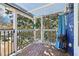 Cozy covered porch with string lights and a view of surrounding trees and homes at 930 Custer St, Atlanta, GA 30354