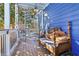 Relaxing back porch with seating and access to a spiral staircase at 930 Custer St, Atlanta, GA 30354