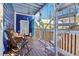 Charming covered porch featuring a spiral staircase and outdoor seating area at 930 Custer St, Atlanta, GA 30354