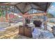 Covered backyard patio with dining area and barbecue, ideal for outdoor entertaining at 930 Custer St, Atlanta, GA 30354