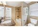 Bright bathroom featuring double sinks and a bathtub shower at 930 Custer St, Atlanta, GA 30354