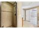 Walk-in shower with a glass door and a tile surround at 930 Custer St, Atlanta, GA 30354