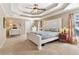 Spacious main bedroom with a trey ceiling, carpeted floors, and lots of natural light at 930 Custer St, Atlanta, GA 30354
