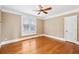 Bedroom with hardwood flooring, large window, and a ceiling fan at 930 Custer St, Atlanta, GA 30354