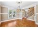 Elegant dining room with hardwood floors, crown molding, and large windows that fill the room with natural light at 930 Custer St, Atlanta, GA 30354