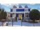 Charming two-story home with a blue exterior, bright yellow door, and inviting front porch at 930 Custer St, Atlanta, GA 30354