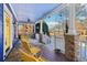 Spacious front porch with rocking chairs, ceiling fan, and view of the neighborhood at 930 Custer St, Atlanta, GA 30354