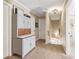 Hallway with carpet and a vintage cabinet on the left at 930 Custer St, Atlanta, GA 30354