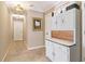 Hallway with carpet and a vintage cabinet on the right at 930 Custer St, Atlanta, GA 30354