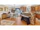 Spacious eat-in kitchen featuring stainless appliances, granite countertops, stone accents, and wood floors at 930 Custer St, Atlanta, GA 30354