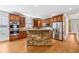 Modern kitchen with stainless steel appliances, custom cabinets, and a center island with stone accents at 930 Custer St, Atlanta, GA 30354