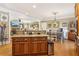 Gourmet kitchen with stainless steel appliances, granite countertops, custom island, and eat in breakfast nook at 930 Custer St, Atlanta, GA 30354