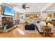 Comfortable living room featuring a stone fireplace, hardwood floors, and large windows providing ample natural light at 930 Custer St, Atlanta, GA 30354