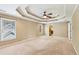 Unfurnished main bedroom with a large window, trey ceiling, and neutral carpet at 930 Custer St, Atlanta, GA 30354