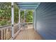 The porch features a unique spiral staircase that leads to the backyard of the home at 930 Custer St, Atlanta, GA 30354