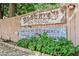 A backyard fence with business signage and lush landscaping at 930 Custer St, Atlanta, GA 30354