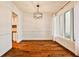 Dining room features hardwood floors and a view into kitchen at 21 Ivy Ne Rdg, Atlanta, GA 30342