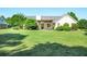 Expansive backyard view of a home showing an ample lawn space with landscaping and hardscaping at 320 Windermere Dr, Loganville, GA 30052