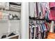 Walk-in closet providing ample storage with organized shelves and hanging space at 320 Windermere Dr, Loganville, GA 30052