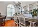 Bright dining room with built-in shelves, large window, and modern light fixture at 320 Windermere Dr, Loganville, GA 30052