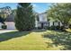 Well-maintained two-story home with lush lawn and mature trees in a peaceful setting at 320 Windermere Dr, Loganville, GA 30052
