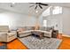 Bright living room features a vaulted ceiling, hardwood floors and neutral decor at 320 Windermere Dr, Loganville, GA 30052