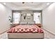 Bright main bedroom boasts a decorative rug, neutral walls, and natural light at 320 Windermere Dr, Loganville, GA 30052