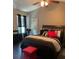 Spacious bedroom with a king-size bed and dark hardwood floors at 5680 Cascade Sw Run, Atlanta, GA 30336