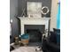 Modern fireplace with decorative mantle and artwork at 5680 Cascade Sw Run, Atlanta, GA 30336