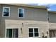 Tan house exterior with white windows and sliding glass door at 5680 Cascade Sw Run, Atlanta, GA 30336