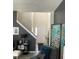 Open living room with fireplace and neutral color palette at 5680 Cascade Sw Run, Atlanta, GA 30336