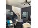 Spacious living area with dark walls and comfy seating at 5680 Cascade Sw Run, Atlanta, GA 30336