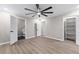 Spacious basement bedroom with wood-look flooring and ceiling fan at 4145 White Oak Dr, Winston, GA 30187