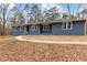 Newly renovated ranch home with gray brick exterior and landscaped yard at 4145 White Oak Dr, Winston, GA 30187