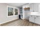 Kitchen nook with built-in wine cooler and blue tile backsplash at 4145 White Oak Dr, Winston, GA 30187