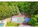 Aerial view showing the property's large backyard with a tennis court and playground at 4787 Northside Dr, Atlanta, GA 30327