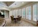 Basement sitting area with a card table and large windows at 4787 Northside Dr, Atlanta, GA 30327