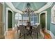 Elegant dining room with arched windows and chandelier at 4787 Northside Dr, Atlanta, GA 30327