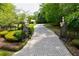 Elegant gated entry with a long paved driveway at 4787 Northside Dr, Atlanta, GA 30327