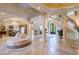 Elegant entryway with sweeping staircase and a circular seating area at 4787 Northside Dr, Atlanta, GA 30327