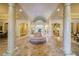 Two-story foyer with grand columns and marble flooring at 4787 Northside Dr, Atlanta, GA 30327